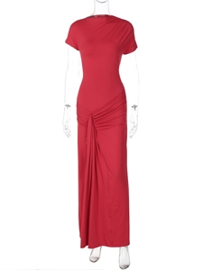 Detail of red slim fit dress showing waist pleats and elegant draped decorative fabric