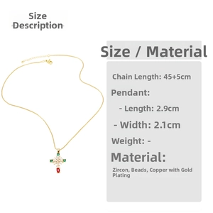Detail of cross necklace with green and red gems, 45+5cm gold-plated copper chain