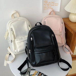 Minimalist large capacity school backpacks in beige, black, and pink with woven zipper pulls