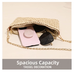 Top view of beige straw bag showing interior capacity with phone and sunglasses