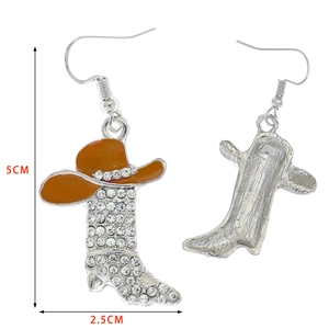 Detail showing western cowboy boot and hat earrings with orange enamel and clear crystals
