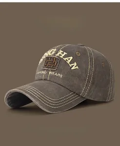 Detail of vintage washed cotton baseball cap with yellow 3D embroidery and stitching