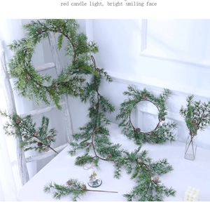 Collection of artificial pine wreaths and garlands with cones for Christmas decor