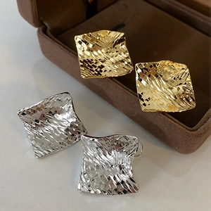 Rhombic textured square stud earrings in gold and silver finish with woven design