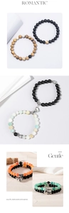 Detail view of magnetic couple bracelets with matte natural stone beads and heart charms