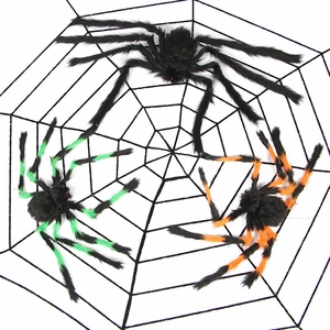 Macro view of Halloween fuzzy spiders with red eyes on a black spider web backdrop