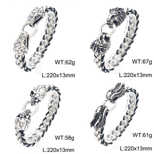 Detail view of four punk woven bracelets featuring lion, snake, dragon, and skull charms