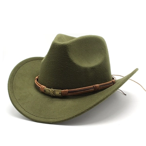 Detail of dark green wool felt cowboy hat with braided band and vintage skull emblem