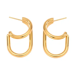 Macro view of gold-plated U-shaped stainless steel earrings with dual-arc design
