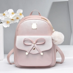 Pink Saffiano leather mini backpack for women featuring a bow and white pom-pom charm