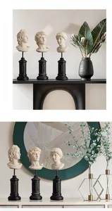 Artistic detail of Greek mythology resin busts on elegant black cylindrical pedestals