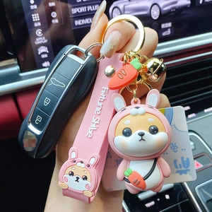Pink Shiba Inu rabbit costume keychain with silicone wrist strap and gold bell