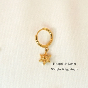 Detailed view of 14K gold plated hoop earring with star pendant, 12mm size and 0.9g weight
