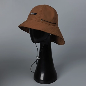 Detail of tear-resistant nylon hiking hat with adjustable drawstring and windproof cord