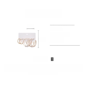 Detailed view of a 10-piece gold hoop earring set with pearls and textured designs