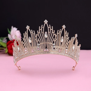 Close-up of rose gold bridal tiara with sparkling rhinestones and wing-like details