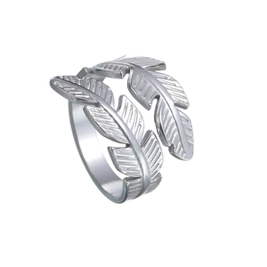 Macro detail of silver feather ring showing fine engraved textures and open band design