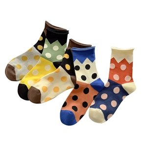 Five pairs of Japanese style polka dot crew socks in various vibrant cotton knit colors