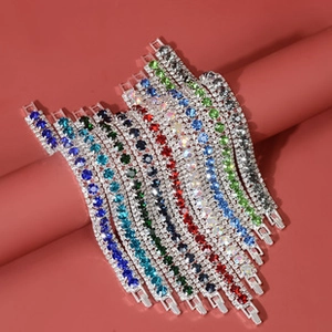 Detailed view of colorful crystal teardrop tennis bracelets in various vivid stone colors