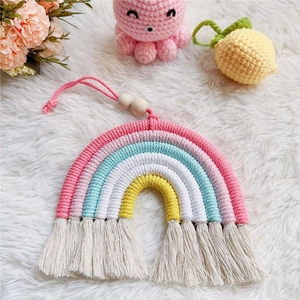Handwoven rainbow cotton rope wall hanging with pink tassels and wooden beads decor