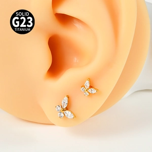 Titanium F136 internal thread butterfly labret stud with zircon on a silicone ear model