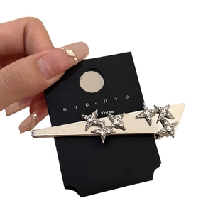 Sparkling star rhinestone hair clip in silver alloy held for size demonstration