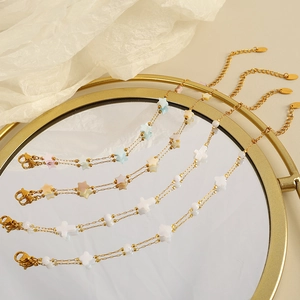 Minimalist gold star and cross shell pendant necklaces set for women on mirror