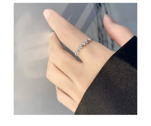 Close-up of S925 sterling silver beaded anxiety ring with sparkling zircon stones