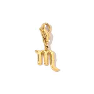 Macro detail of Scorpio zodiac charm with 14K gold plating and lobster clasp attachment
