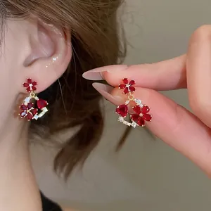 Exquisite 18k gold plated flower drop earrings with red heart gems for women