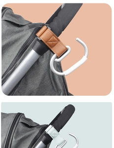 Detail of leather stroller hooks in brown and light blue with silver alloy clips
