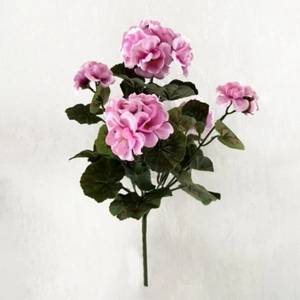 Close-up of artificial pink geranium bouquet with realistic green leaves for home decor