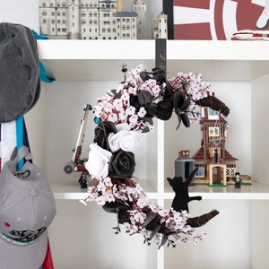 Halloween crescent moon wreath with black roses and a cat silhouette on a branch base