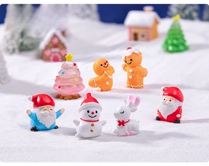Macro view of 7-piece Christmas miniature figurine set with Santa and reindeer
