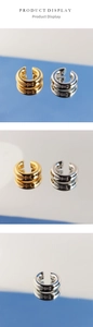 Detailed view of polished C-shaped chunky ear cuffs in gold and silver finishes