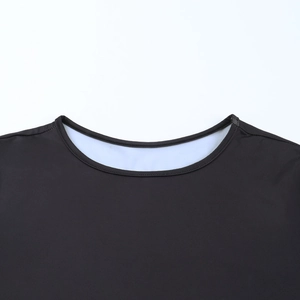 Detailed view of the ribbed crew neckline on a black slim-fit backless mini dress