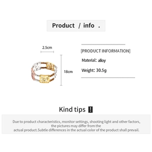 Detailed view of hollow square charms in gold, silver and rose gold on alloy bracelet