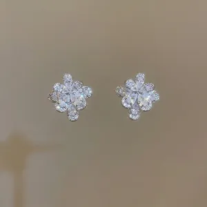 Sparkling zircon flower ear cuffs for women in silver finish with petal cluster design