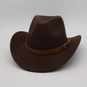 Detail view of the brown wool felt cowboy hat with leather band and metal buckle accent