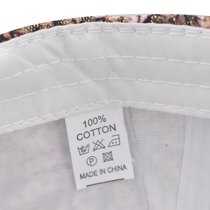 Macro shot of cotton baseball cap interior featuring a white sweatband and material label