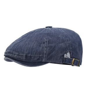 Vintage washed dark blue newsboy cap in denim twill with adjustable bronze metal buckle