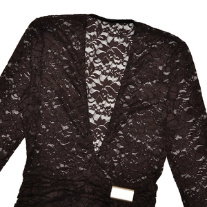 Detailed view of sheer floral lace fabric with elegant V-neckline and metal buckle