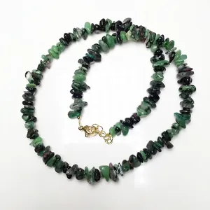 Detailed view of Ruby Zoisite chip stone necklace with adjustable gold clasp