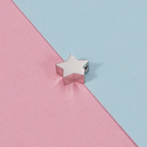 Polished silver stainless steel star pendant bead for jewelry making on bicolor background