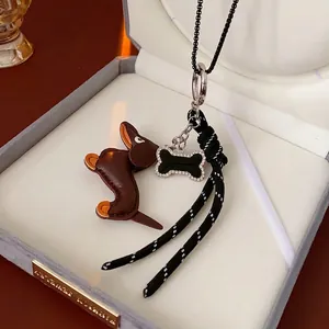 Brown leather dachshund puppy keychain with rhinestone bone charm and woven rope strap