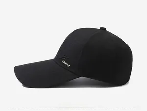 Detailed side view of black baseball cap with embroidered logo and breathable eyelets