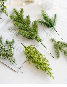 Detail of realistic PE pine needles branches for DIY Christmas tree and wreath decoration