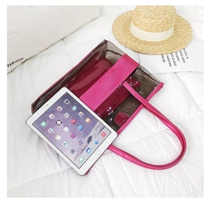 Large PVC transparent beach bag with pink inner pouch and tablet showing high capacity