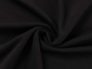 Close-up of soft black knit fabric texture and elegant pleated draping of the T-shirt