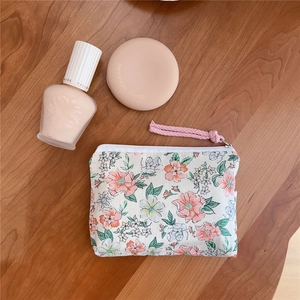 Floral cotton mini storage bag with pink rope zipper pull for coins and lipstick
